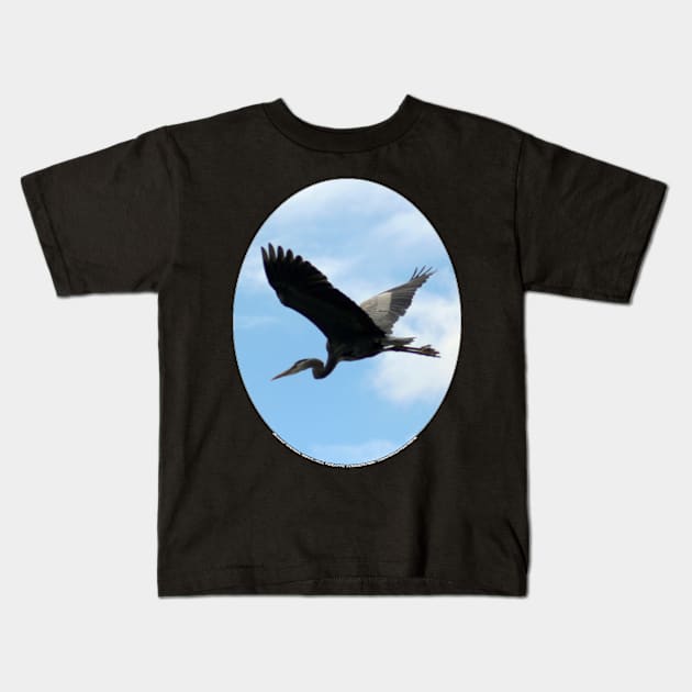 Great Blue Heron Flying Past the Clouds Above Trojan Pond Kids T-Shirt by DlmtleArt